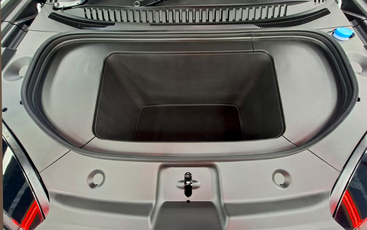 Reflections across the coated panels of the BYD Sealion 7.