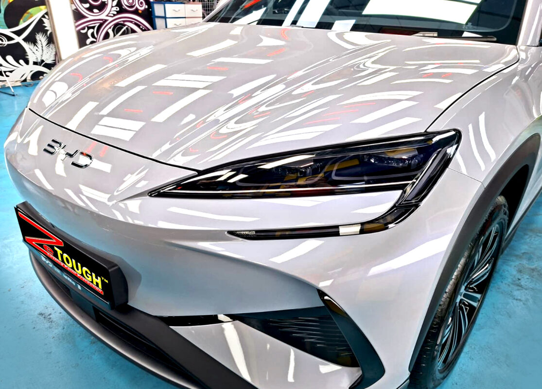 The BYD Sealion's coated paintwork under workshop lighting.