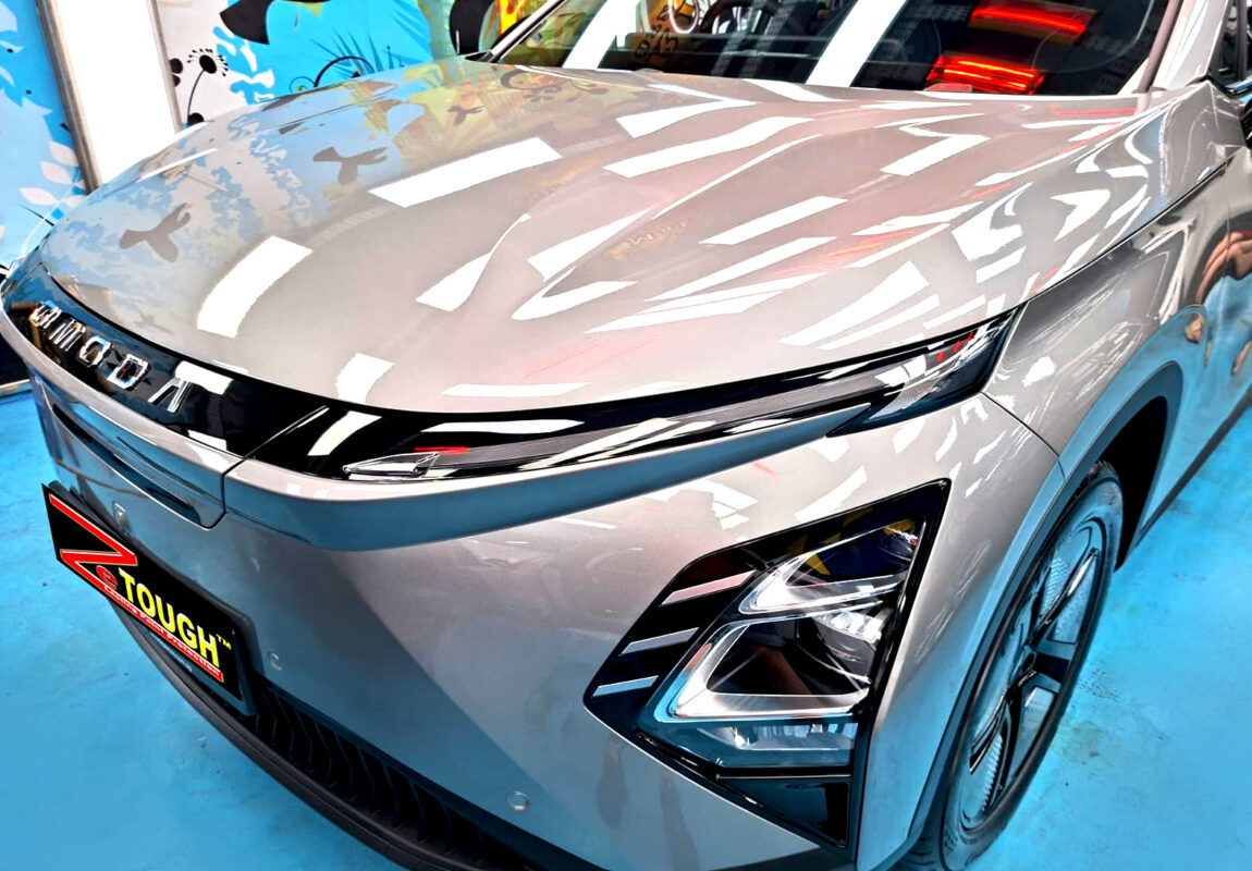 The Chery Omoda's coated paintwork under workshop lighting.