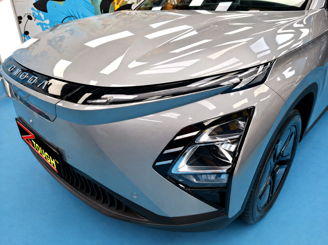 The Chery Omoda's coated paintwork under workshop lighting.