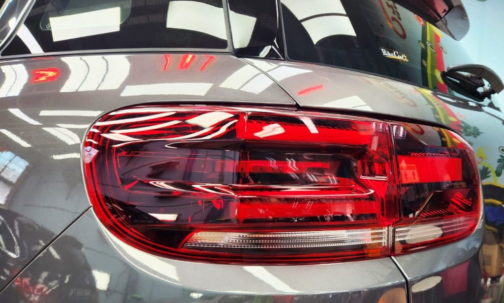 The coated bonnet of the C5 Aircross under workshop lighting.