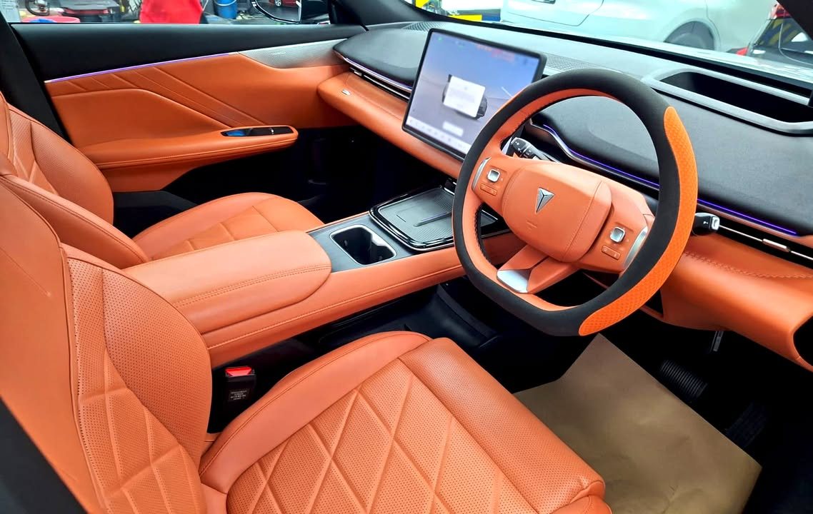 Deepal S05 cabin with tan quilted leather seats and a large centre screen.