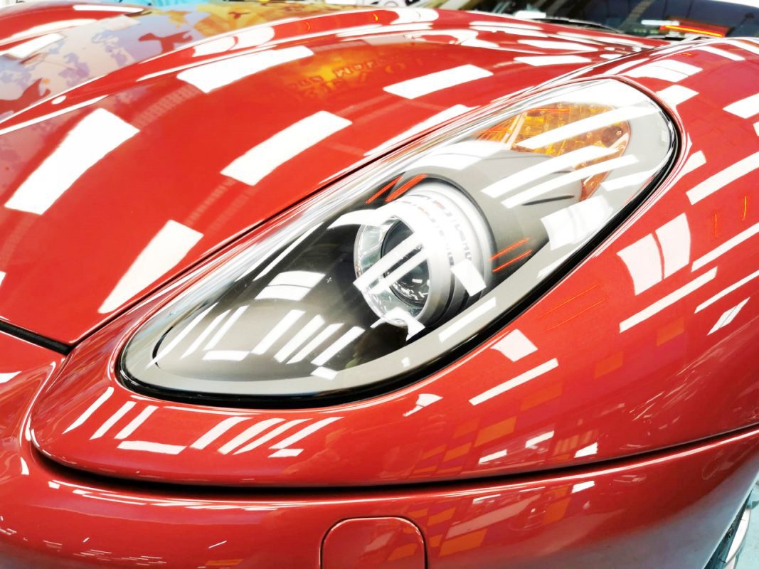 The Ferrari 599's coated paintwork showing clean reflections.