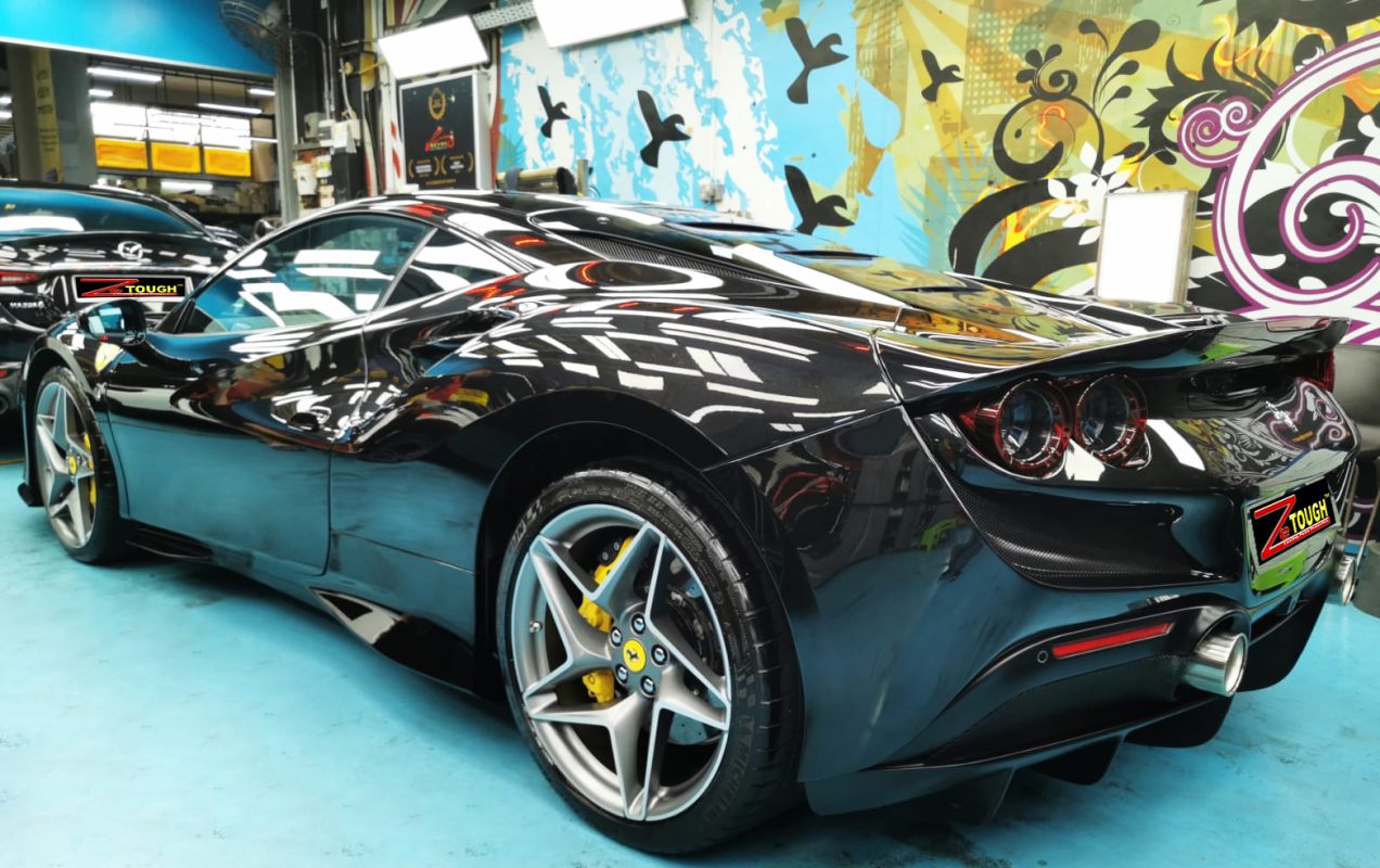 Rear quarter of the Ferrari F8, glossy and protected.