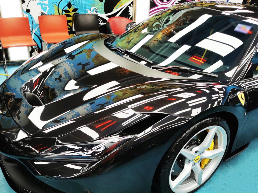 The Ferrari F8 Tributo from a side angle after the ceramic coating.