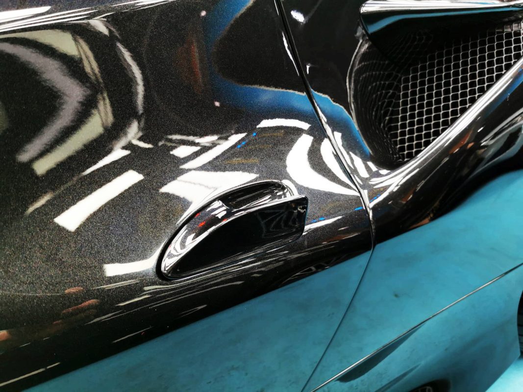 Rear quarter of the Ferrari F8 Tributo, glossy and protected.