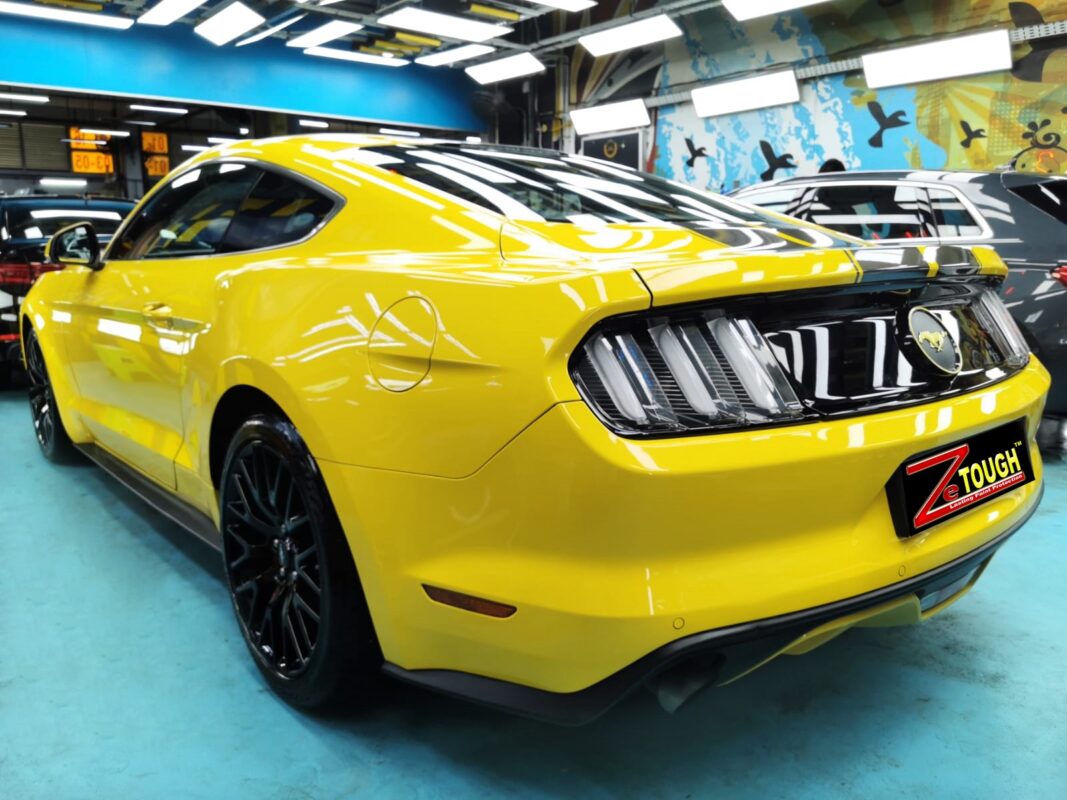 Rear quarter of the Ford Mustang, glossy and protected.