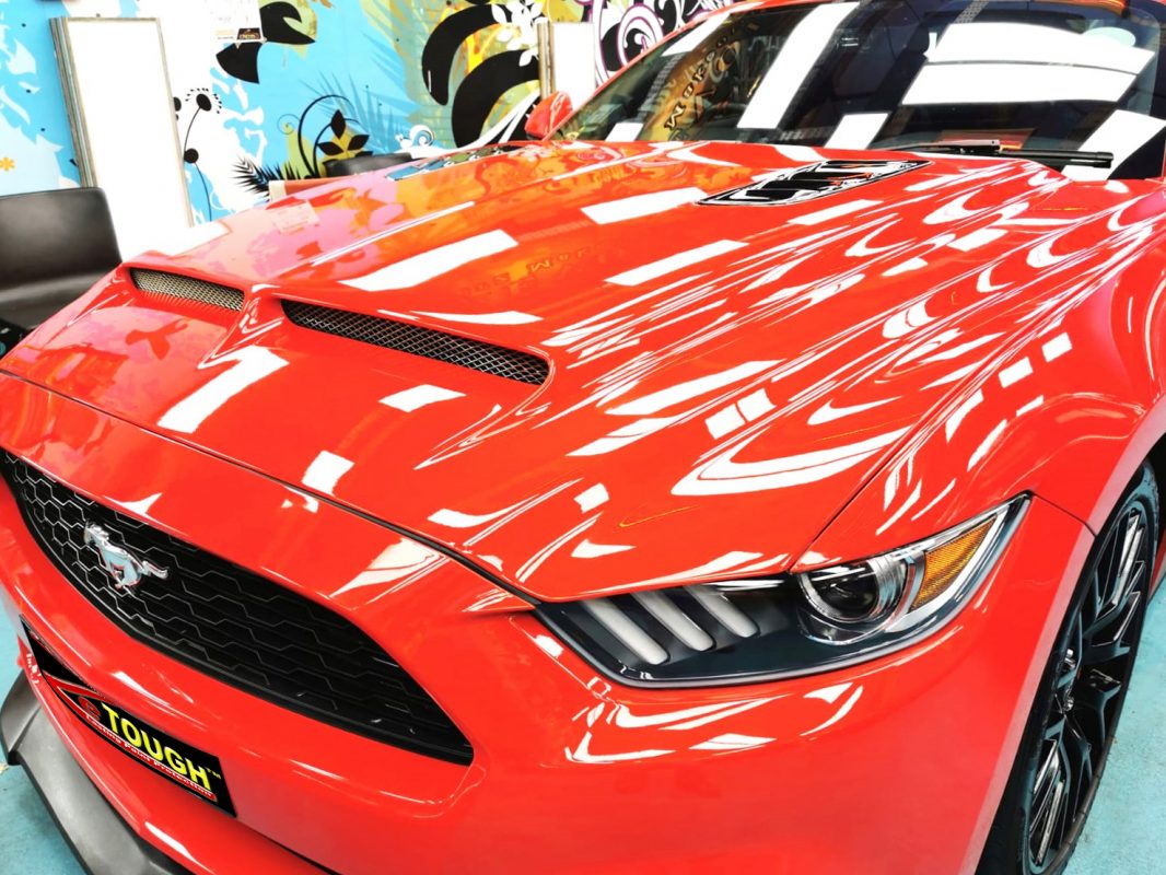The Ford Mustang from a side angle after the ceramic coating.