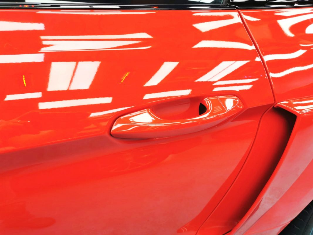 Rear quarter of the Ford Mustang, glossy and protected.