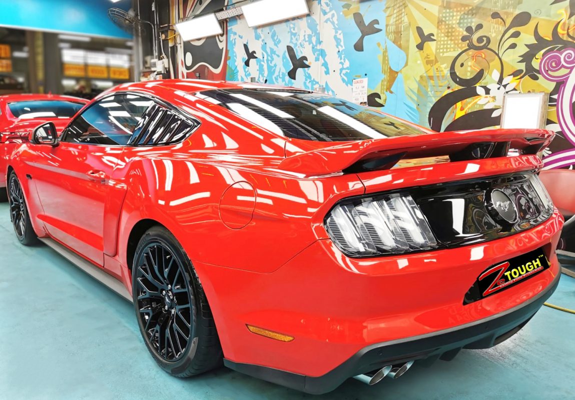The Mustang parked in the workshop, freshly coated.