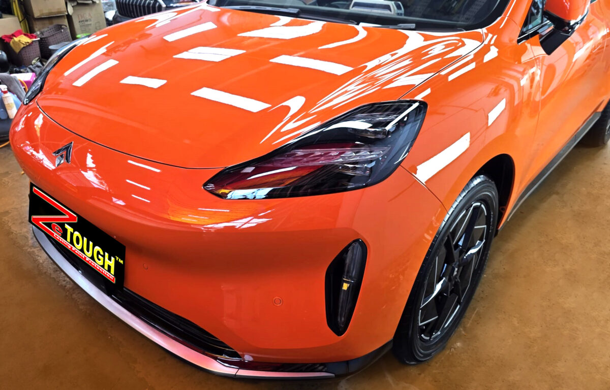 The GAC Aion Hyptec's coated paintwork under workshop lighting.