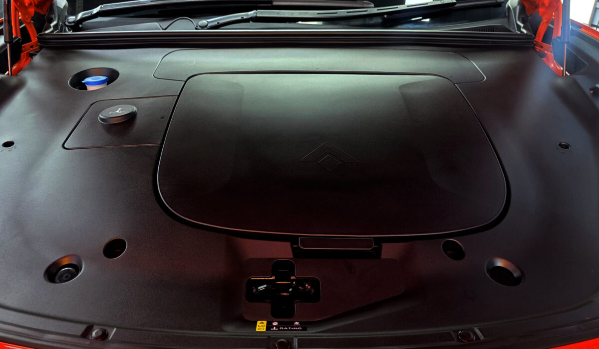 Reflections across the coated panels of the GAC Aion Hyptec.