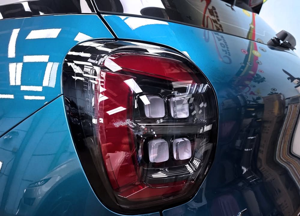 Close-up of the GAC AION tail lamp against the blue body.