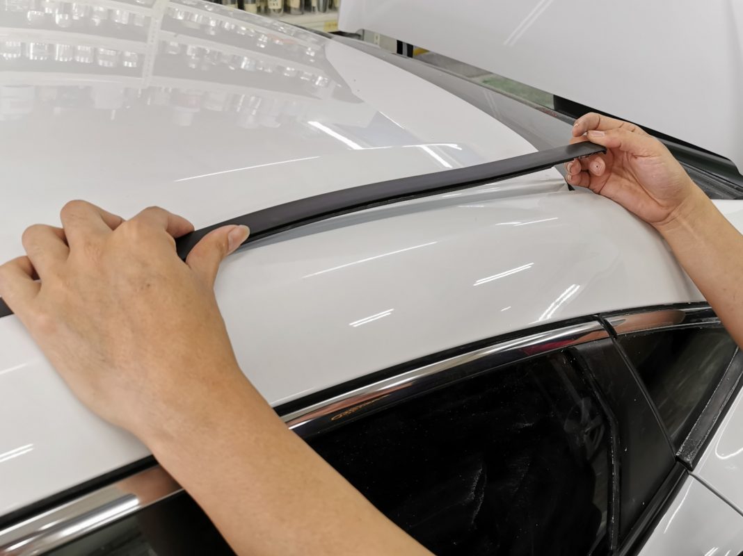 Polishing the new paint on the Civic to bring up the shine.