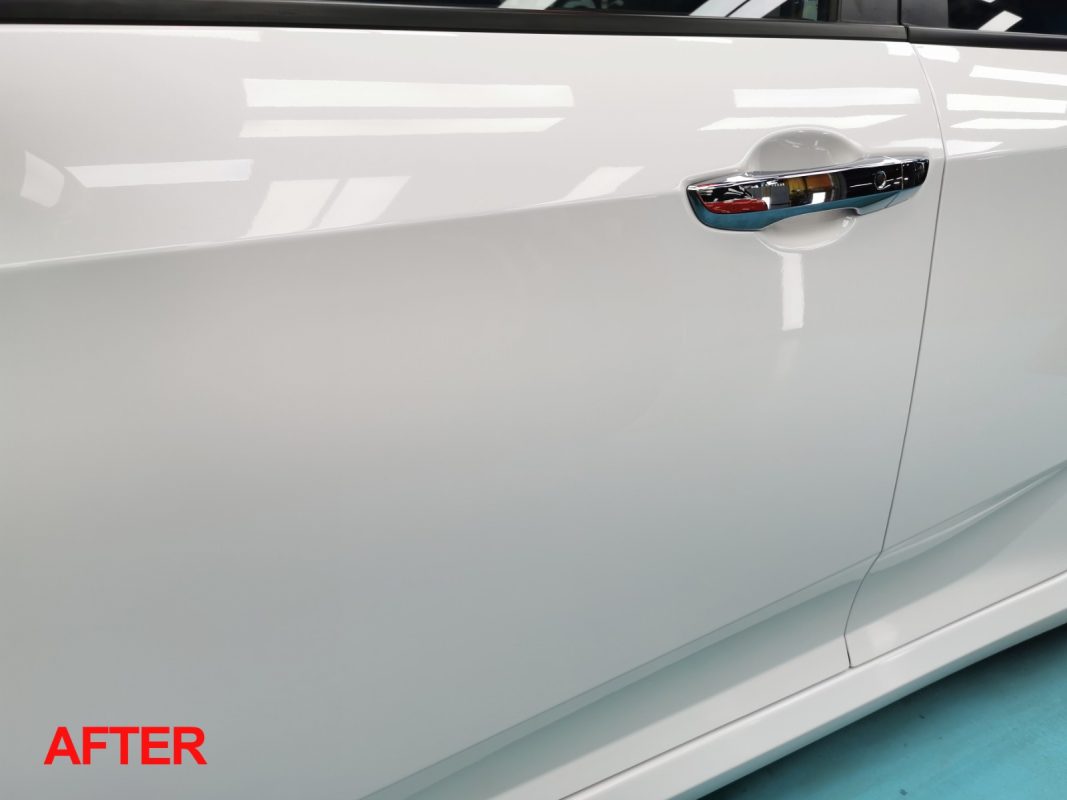 Glossy body panels on the resprayed Civic.