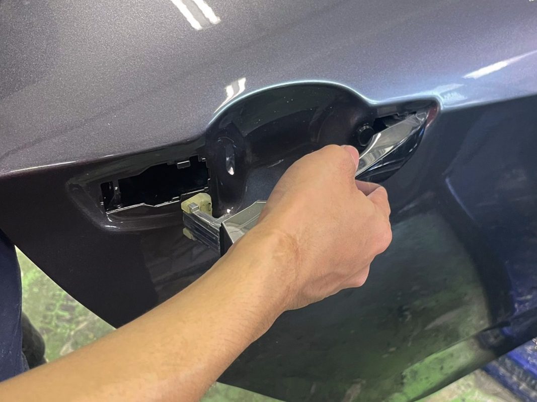 Polishing the new paint on the Civic to bring up the shine.