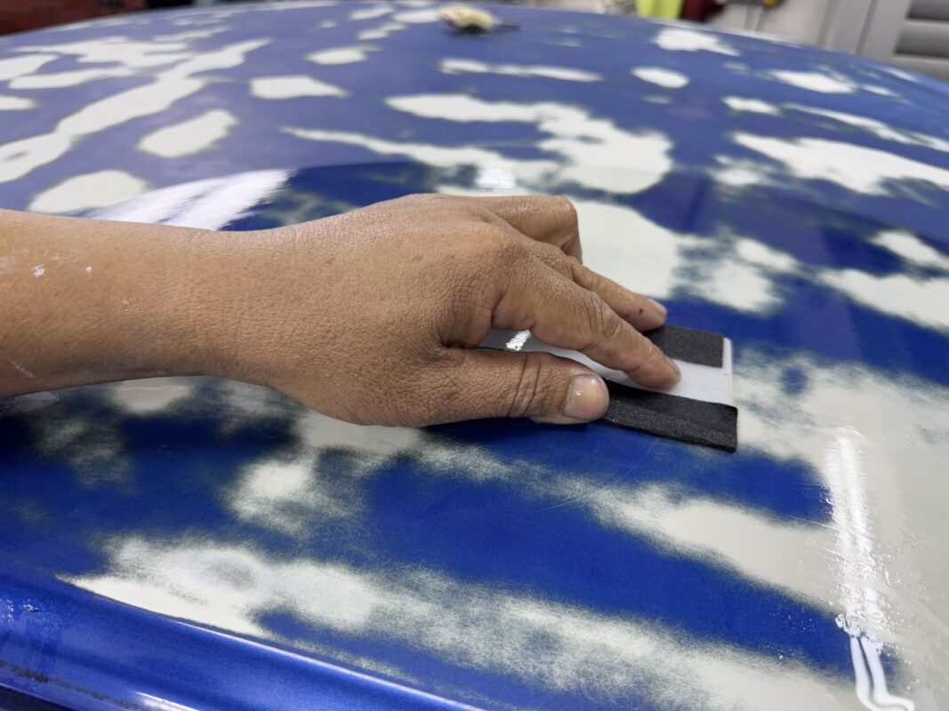 A primer coat applied to the Honda Civic before spraying.