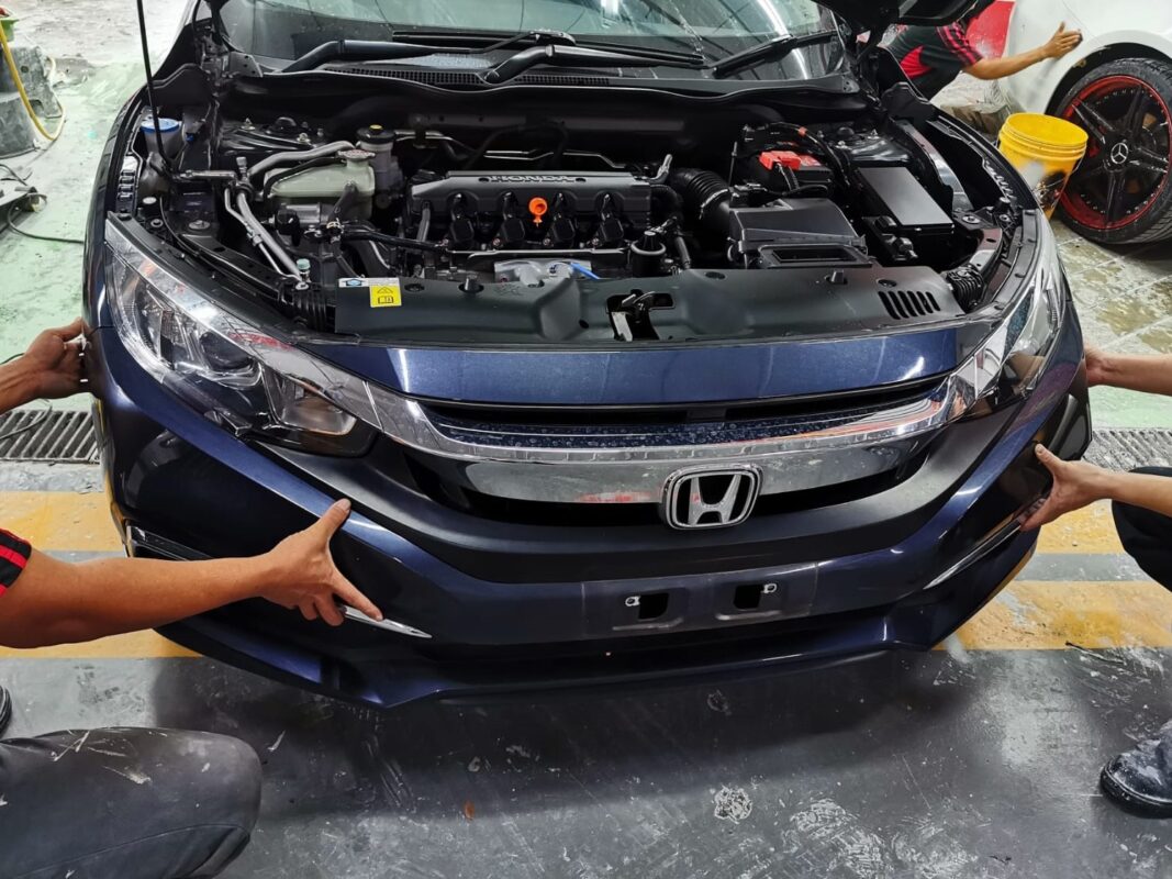 Honda Civic partially stripped, panels and trim removed at the start of day two.