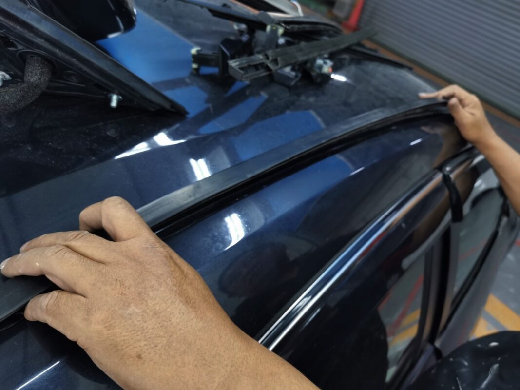 Trim removed from the Honda Civic, surfaces exposed for painting.