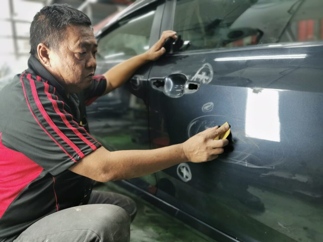 The Honda Civic body panels inspected for scratches and dents on day three.