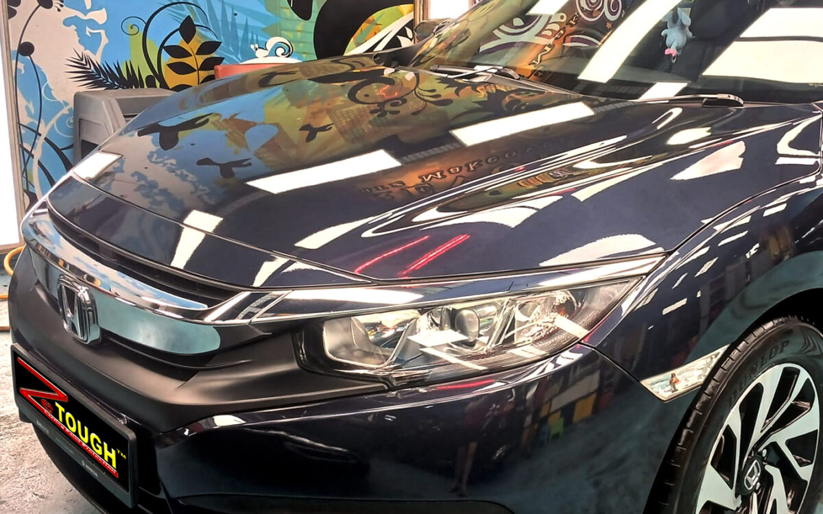 The Honda Civic from a side angle after the ceramic coating.
