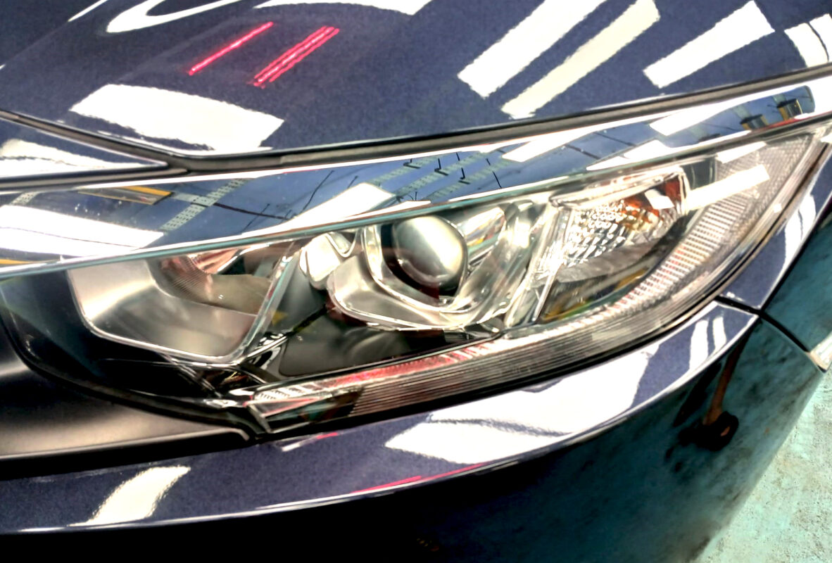 The Civic's coated paintwork showing clean reflections.