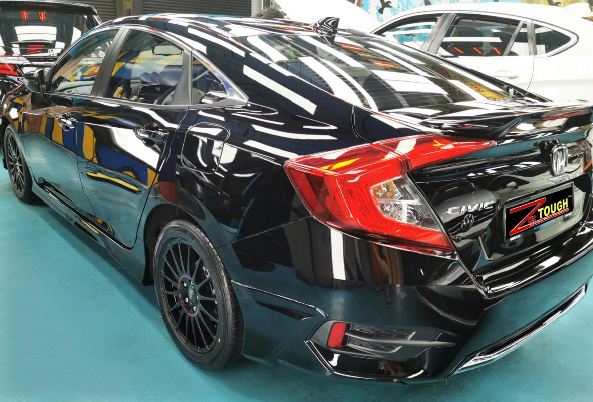 The Civic parked in the workshop, freshly coated.