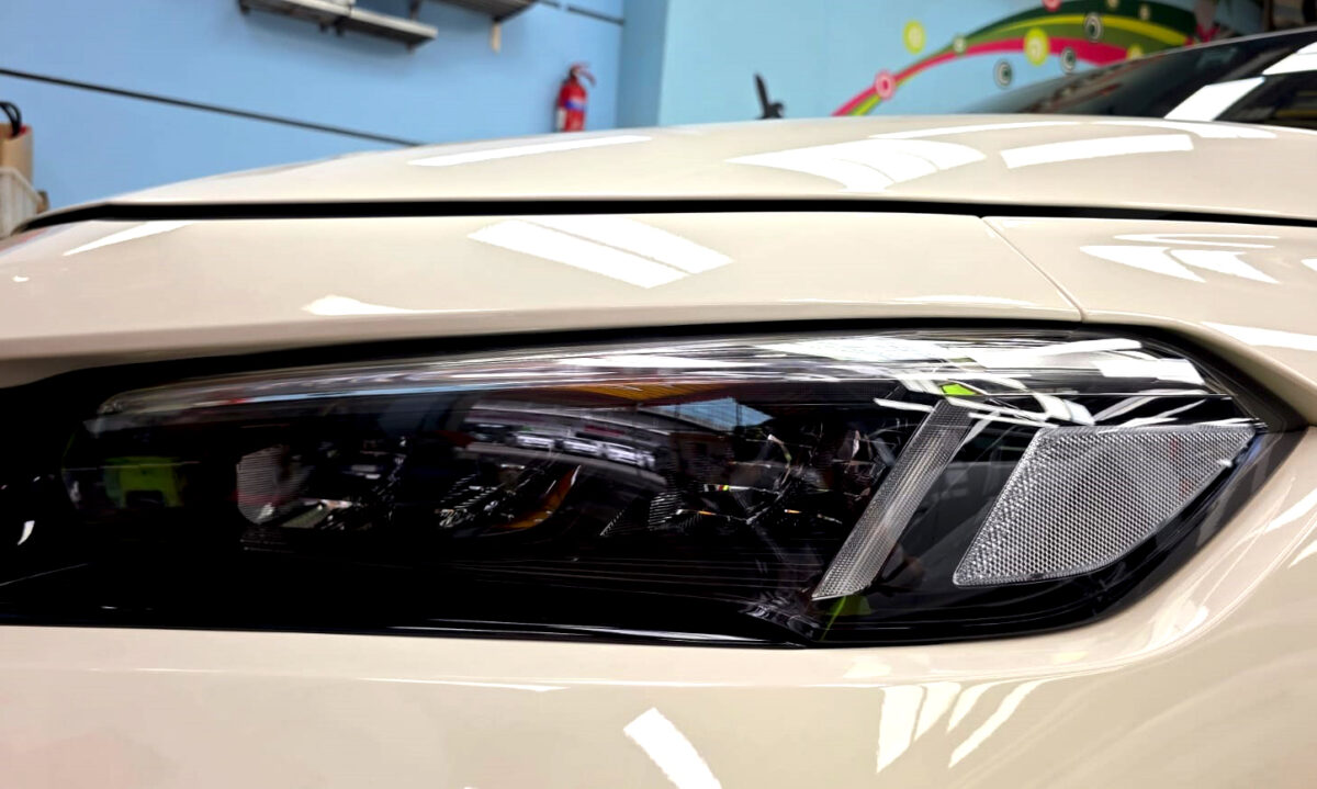 The Civic's coated paintwork showing clean reflections.