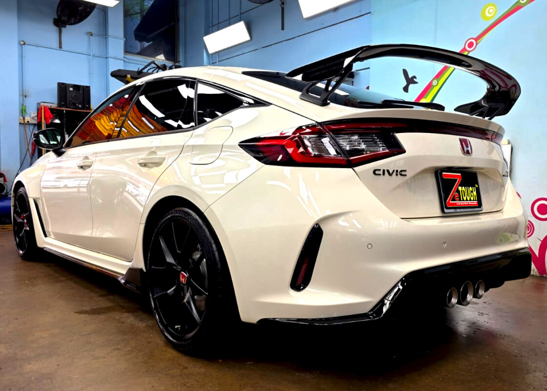 Rear quarter of the Honda Civic, glossy and protected.