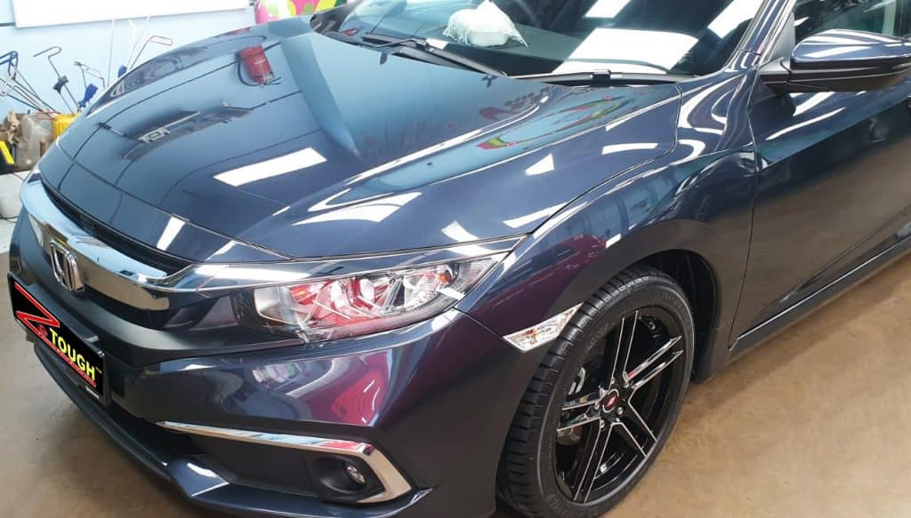The Honda Civic from a side angle after the ceramic coating.