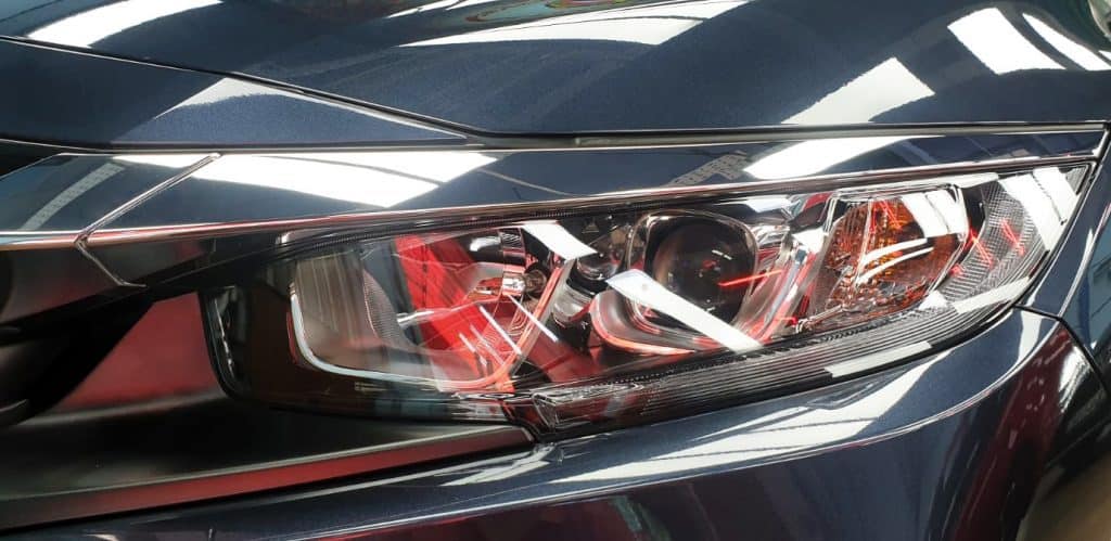 The Civic's coated paintwork holding clean reflections.