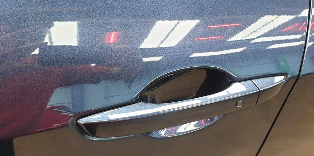 Rear quarter of the Honda Civic, glossy and protected.