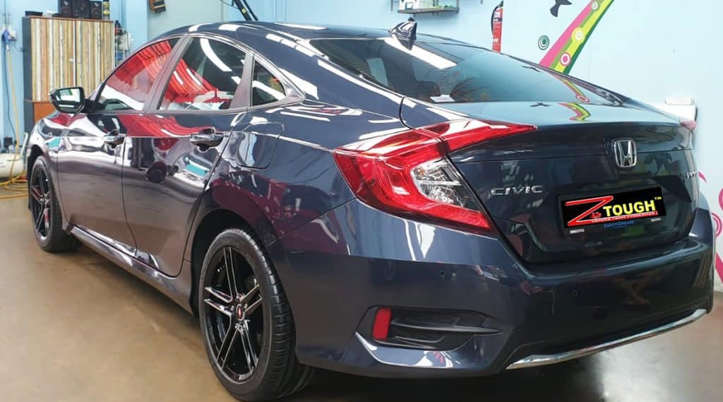 The Civic parked in the workshop, freshly coated.