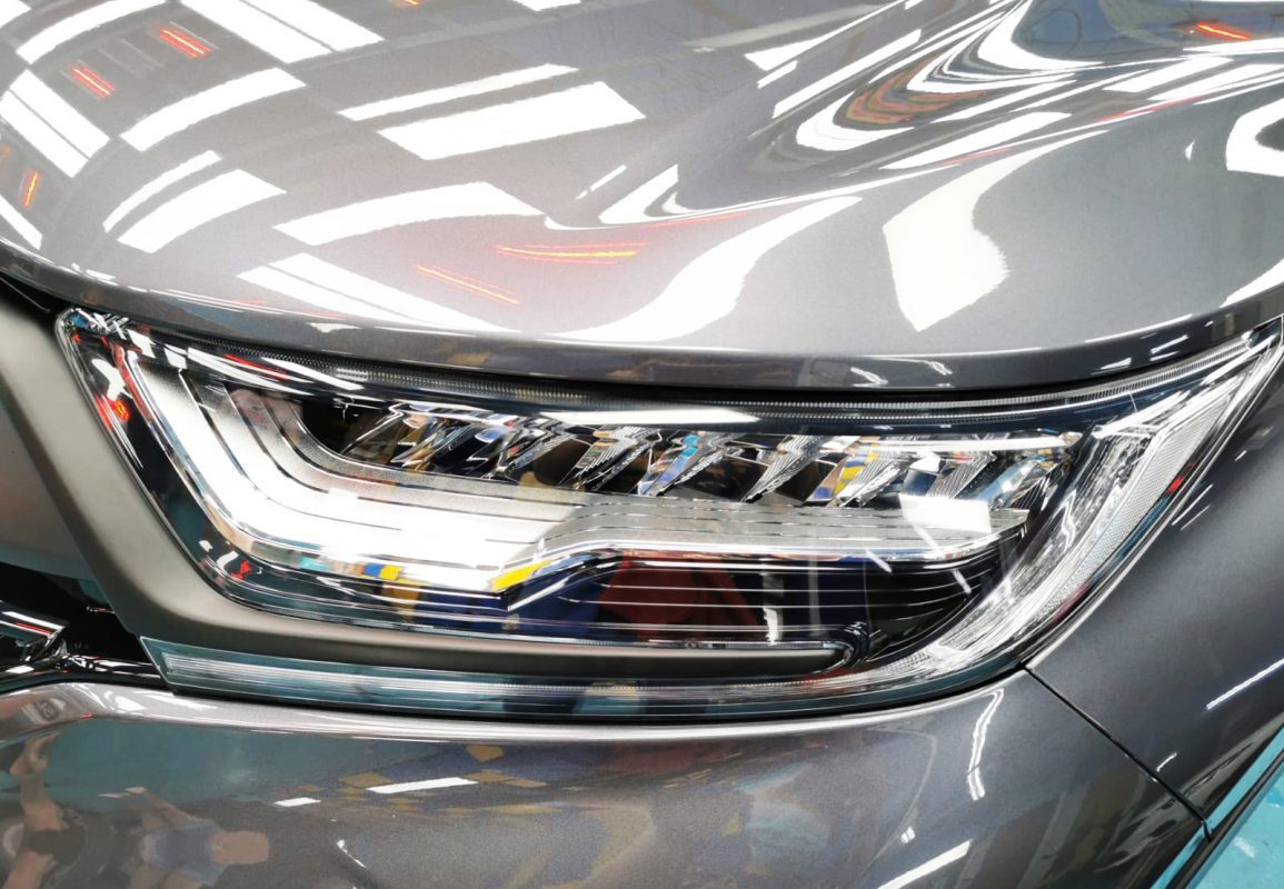 The CR-V's coated paintwork showing clean reflections.