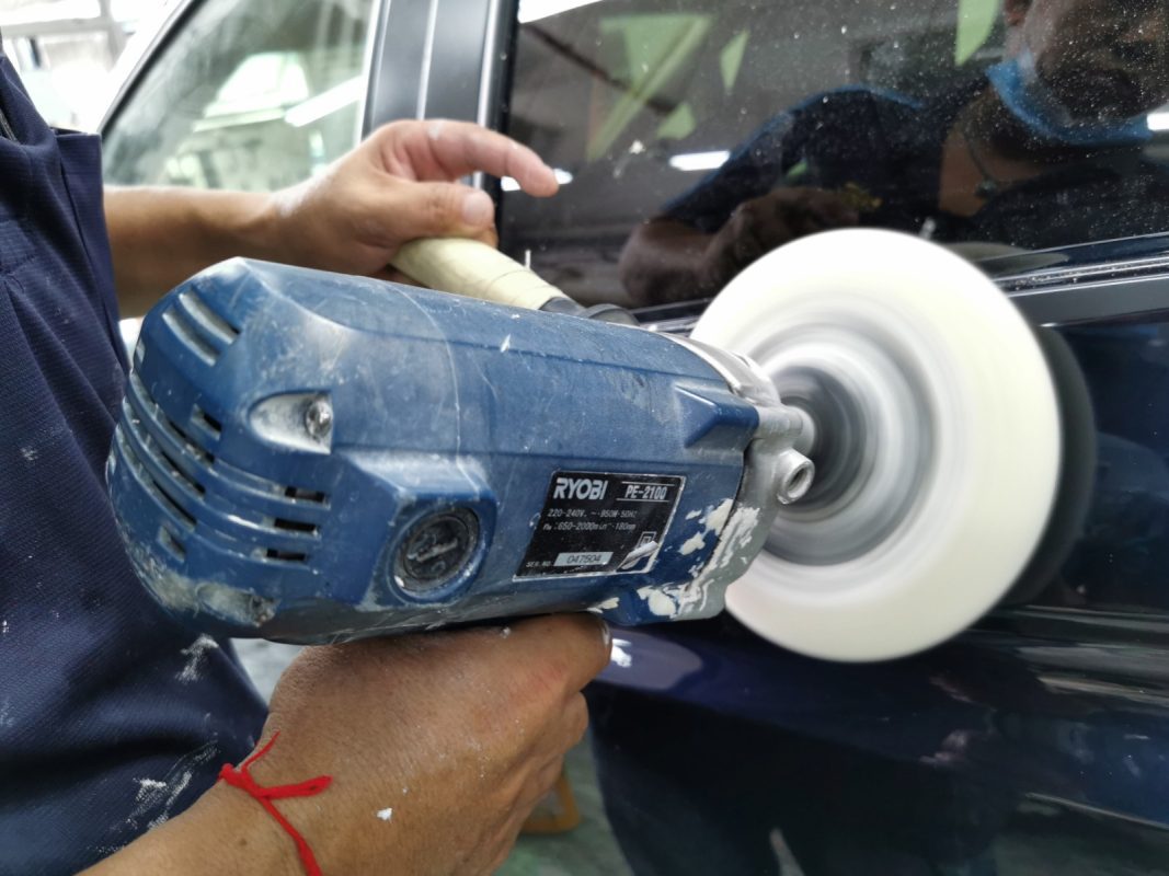 The Fit being wet-sanded again after spraying for an even surface.