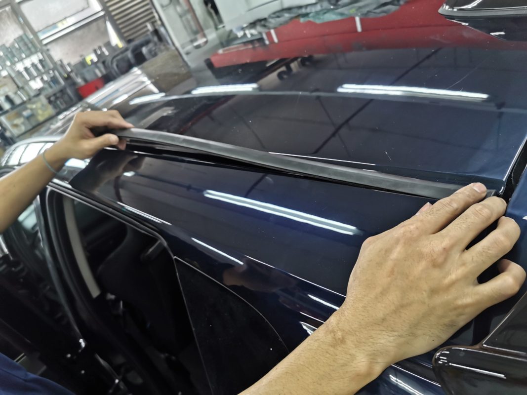 Polishing the new paint on the Fit to bring up the shine.