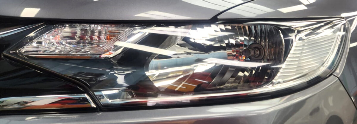 The Fit's coated paintwork showing clean reflections.