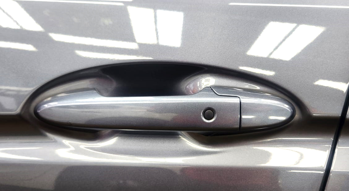 The Honda Fit parked in the workshop, freshly coated.