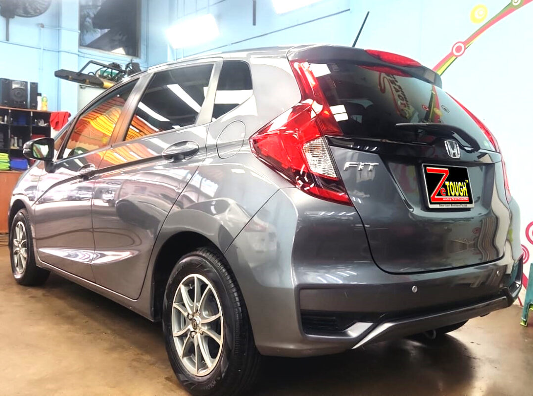 Rear quarter of the Honda Fit, glossy and protected.