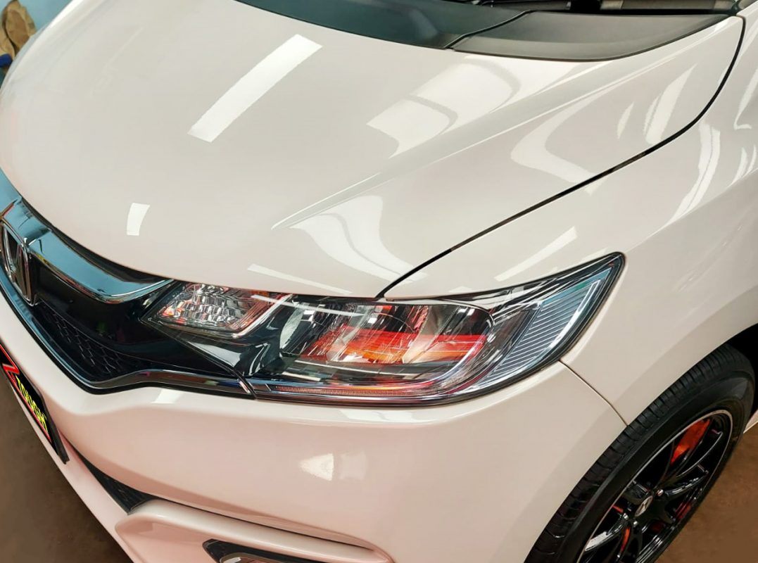 The Honda Fit Hybrid from a side angle after the ceramic coating.