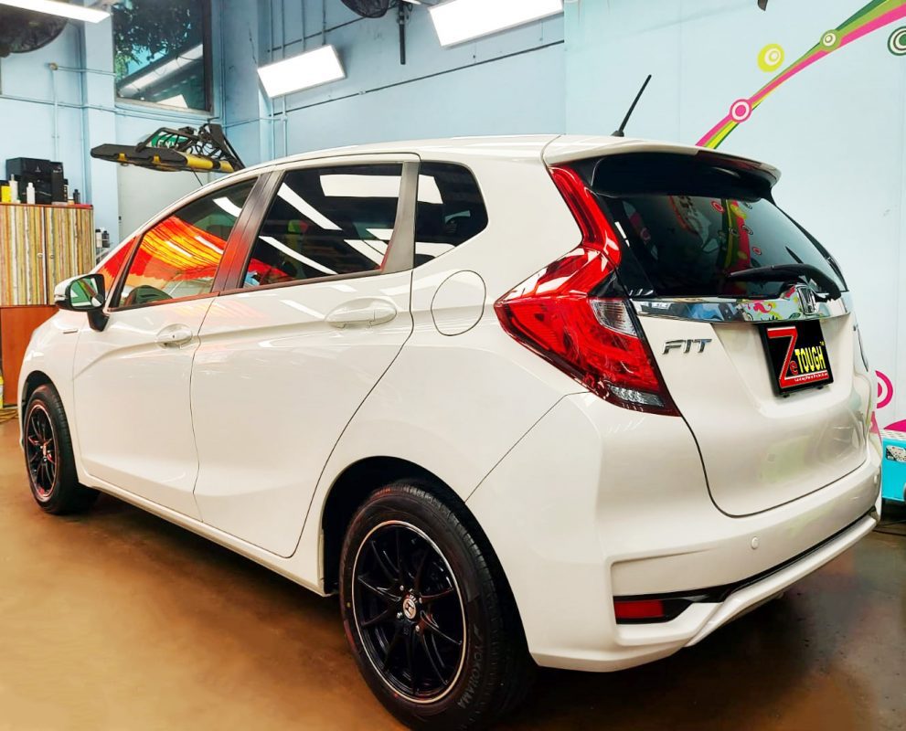 The Fit Hybrid parked in the workshop, freshly coated.