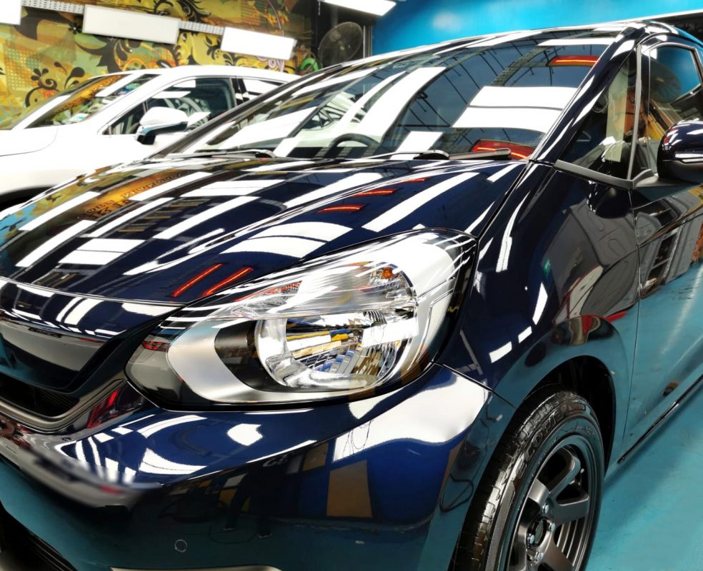The Honda Fit from a side angle after the ceramic coating.
