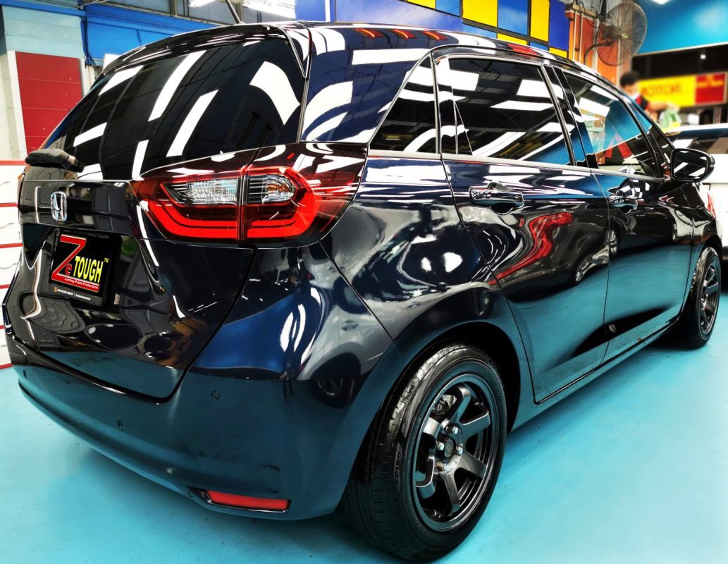 The Fit parked in the workshop, freshly coated.