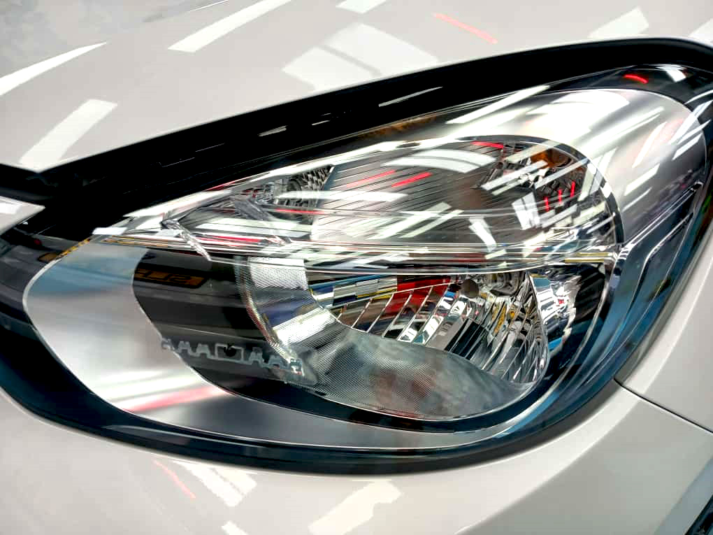 The Fit's coated paintwork showing clean reflections.