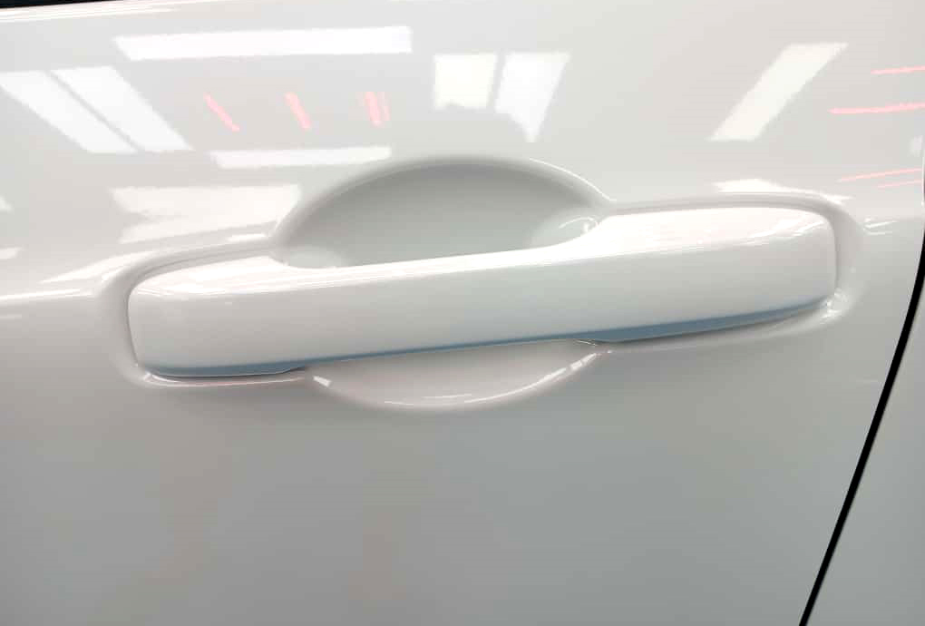 Rear quarter of the Honda Fit, glossy and protected.