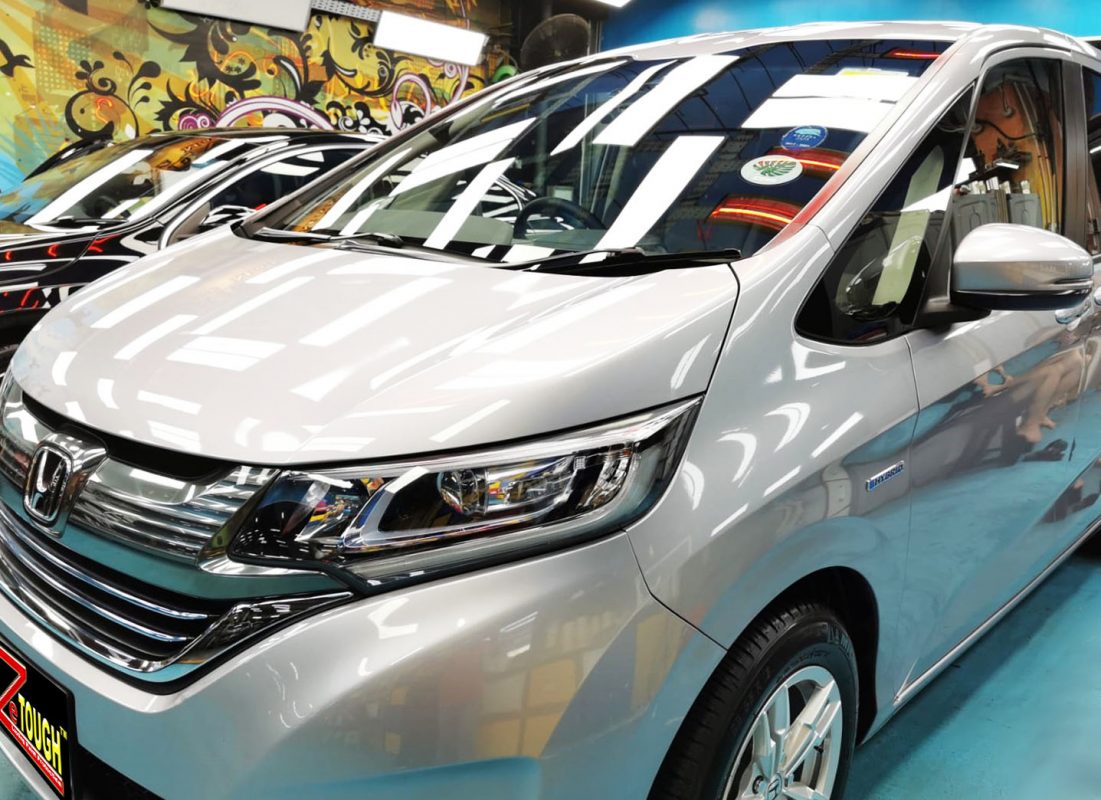 The Honda Freed from a side angle after the ceramic coating.