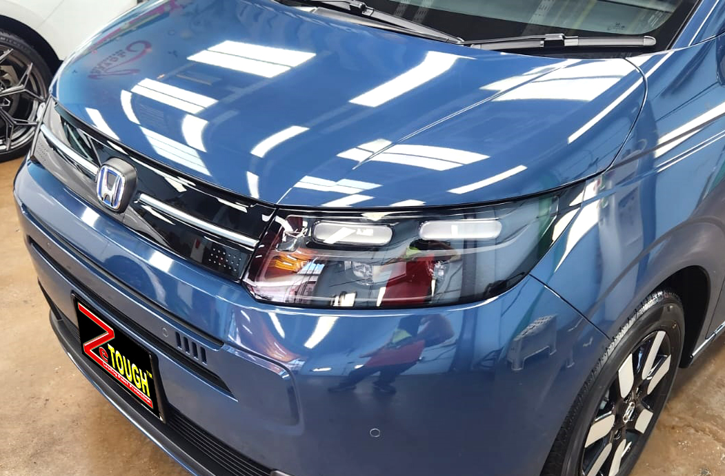 The Honda Freed from a side angle after the titanium coating.