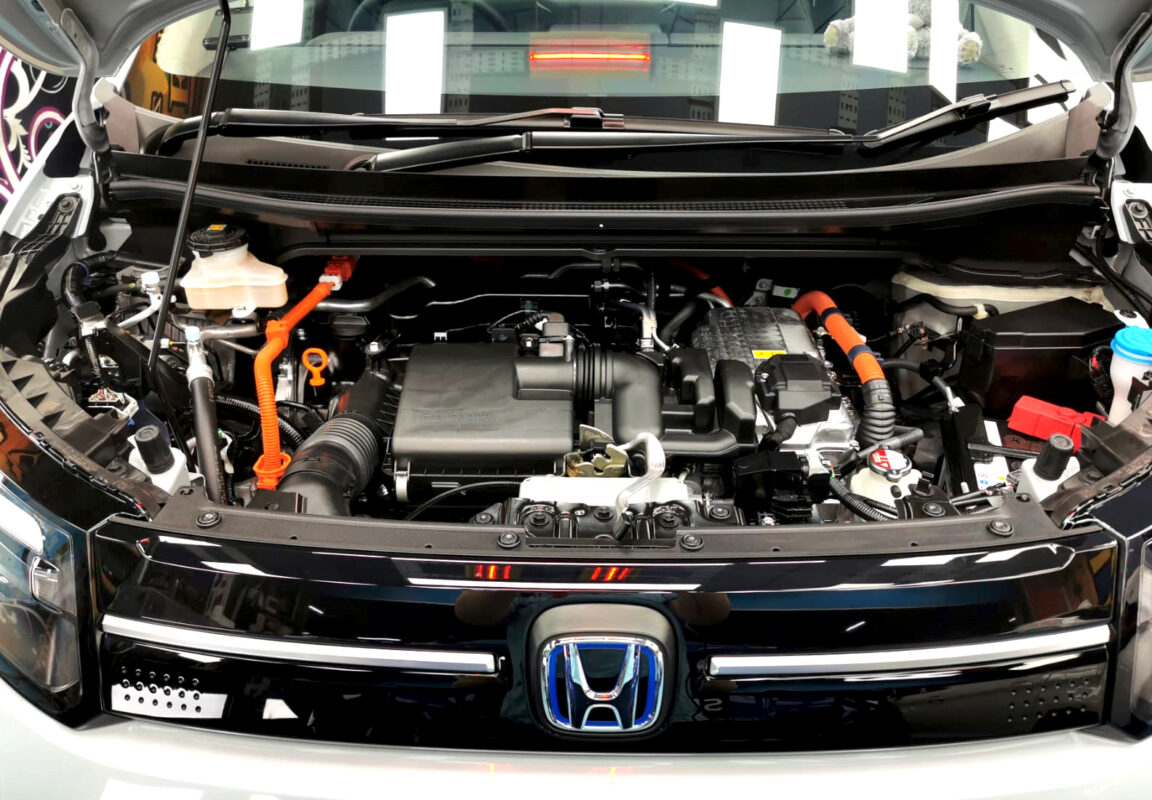 Reflections across the coated panels of the Honda Freed.