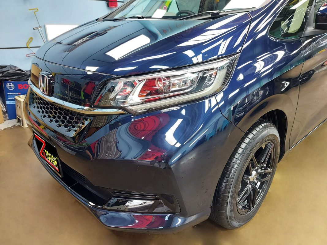 The Honda Freed from a side angle after the titanium coating.