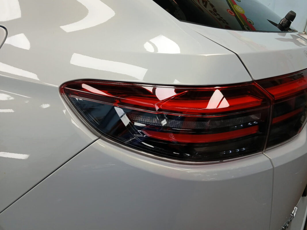 The coated bonnet of the Honda HR-V under workshop lighting.